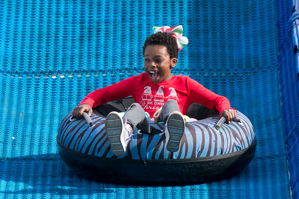 Young Guest On Tubing Slide